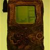 A Game Boy, damaged in the Gulf War, which still w